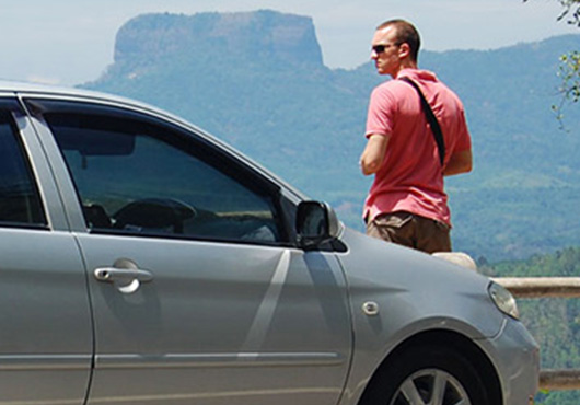 A person on the road with a hired car