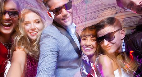 People taking a selfie at a party