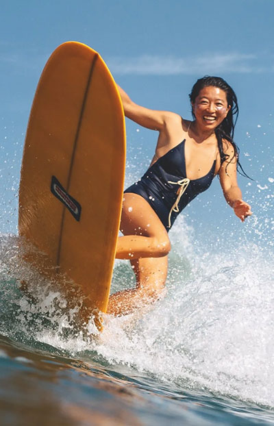 A person surfing through waves