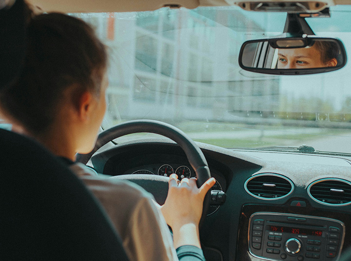 A person driving a car