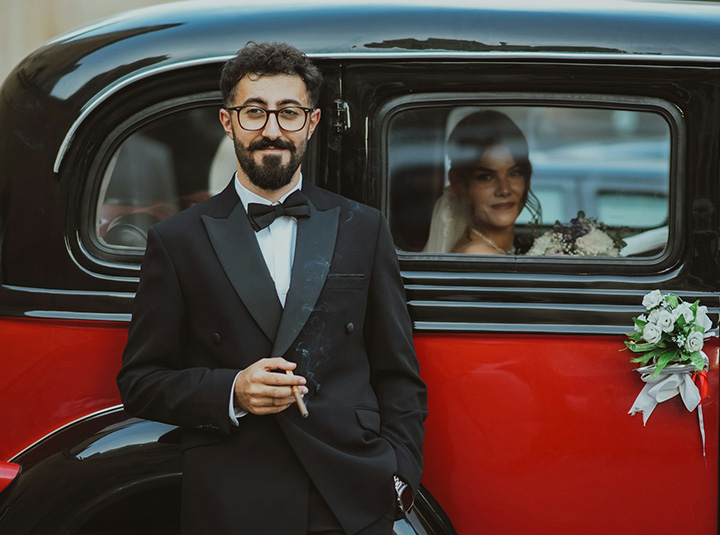Bride and groom in a decorated wedding car by Malkey Rent A Car Colombo
